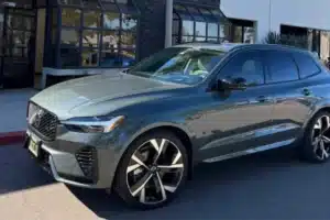 Side view of a gray SUV showcasing its sleek design and large wheels.