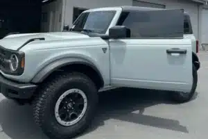 White Ford Bronco with tinted windows and rugged tires