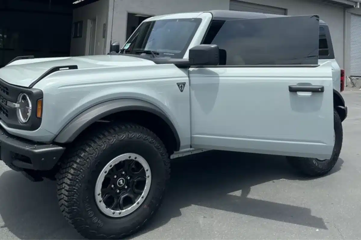 White Ford Bronco with tinted windows and rugged tires