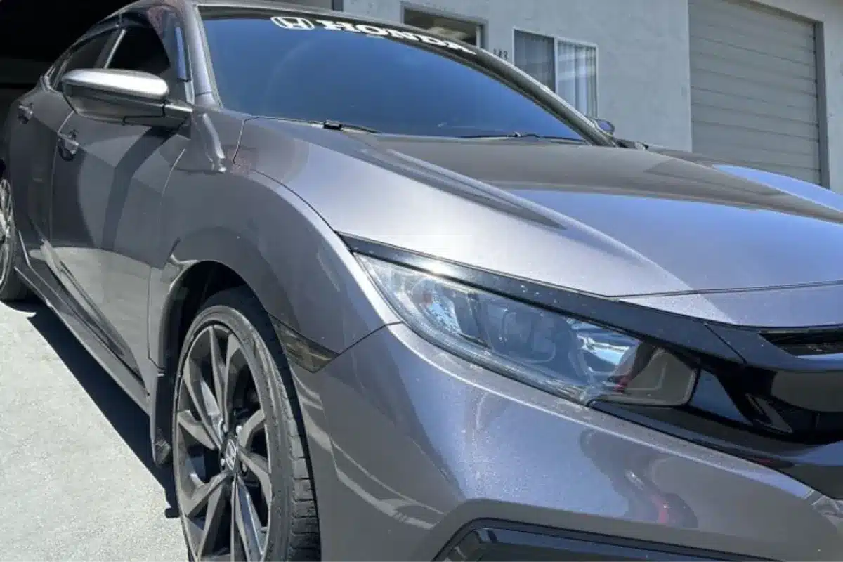 Gray Honda sedan with paint protection film parked outside shop