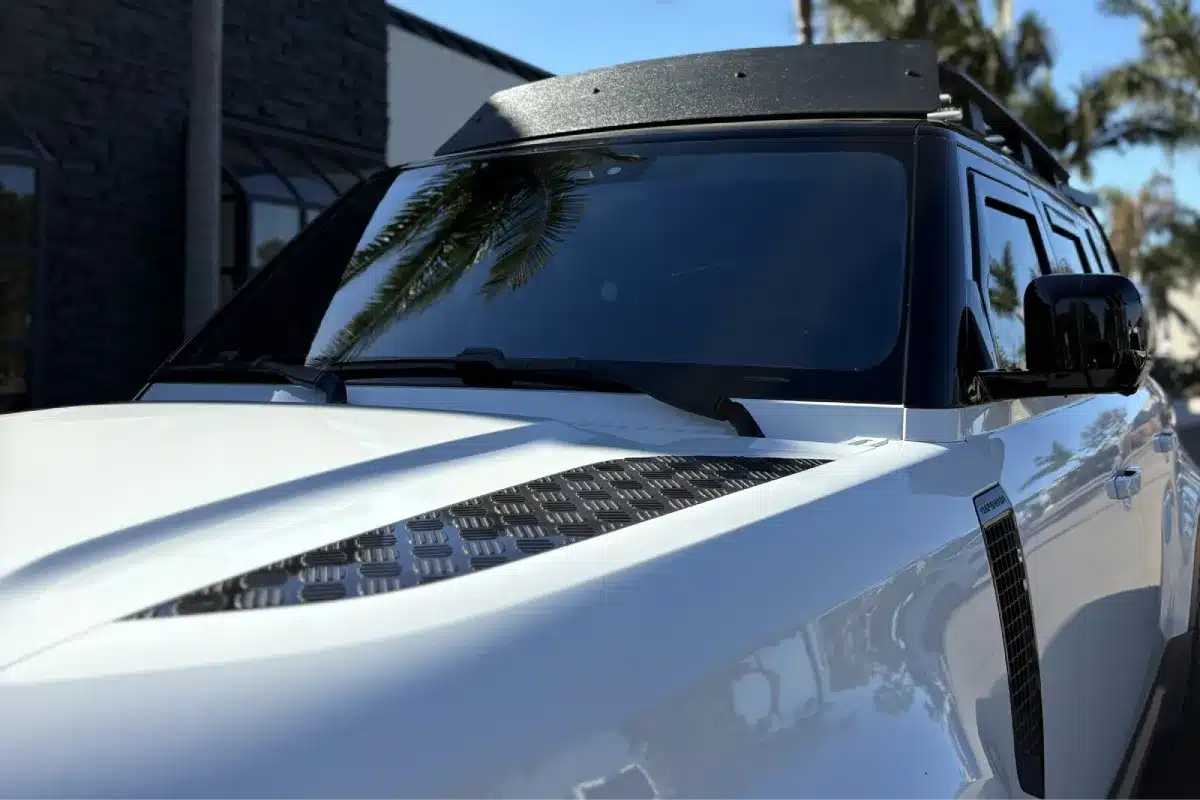 Close-up of SUV windshield showing dark window tint for UV and glare protection.