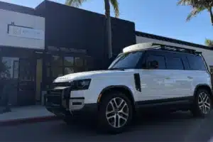 White SUV with professionally installed window tint for privacy and heat reduction.