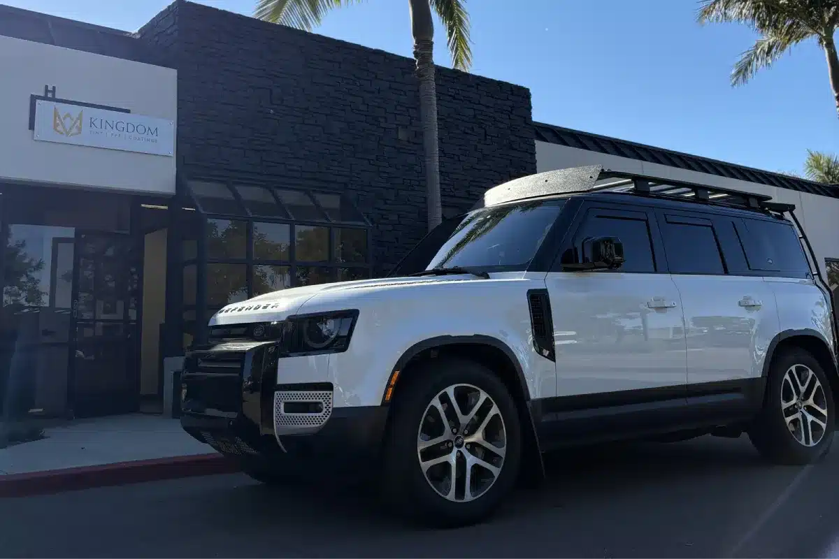 White SUV with professionally installed window tint for privacy and heat reduction.