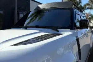 Close-up of tinted windows on a Land Rover Defender.
