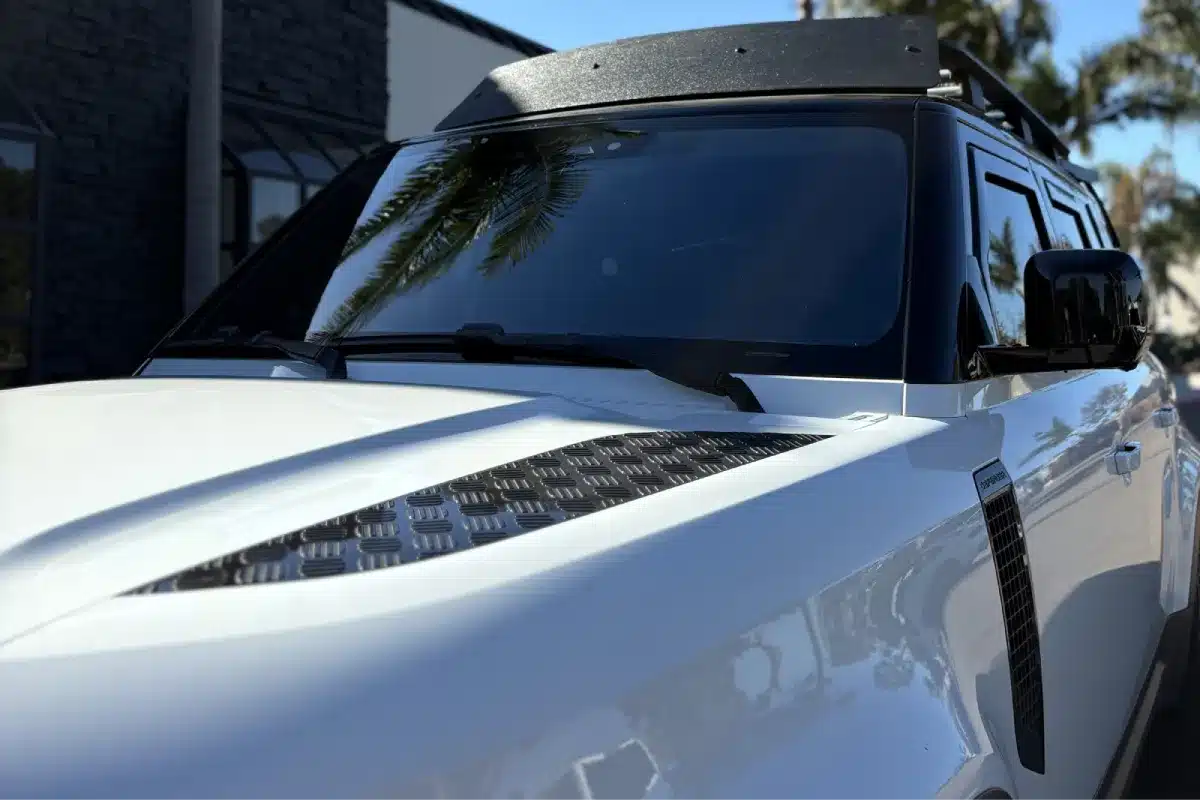 Close-up of tinted windows on a Land Rover Defender.