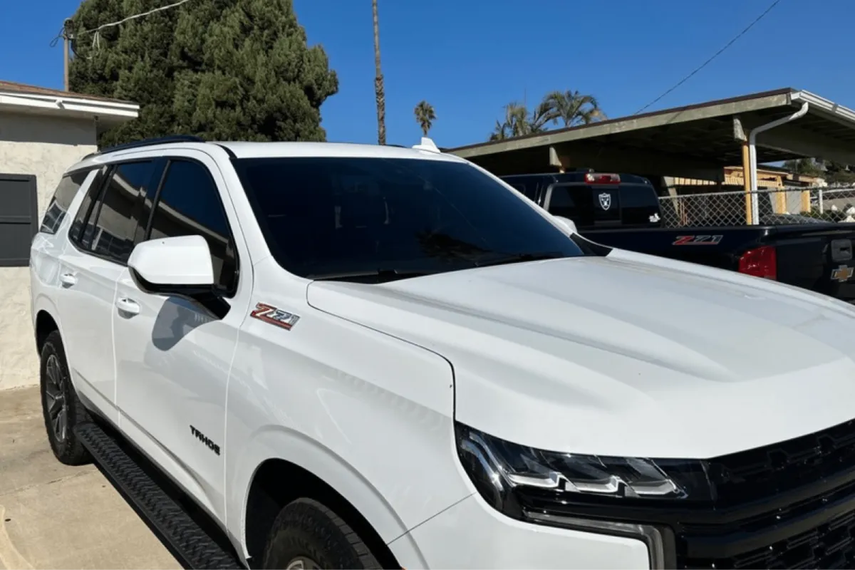 White SUV with dark window tint.
